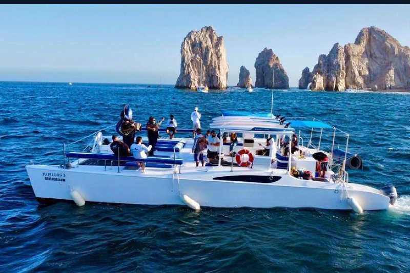 47 foot party catamaran with the Arch of Cabo San Lucas in the background