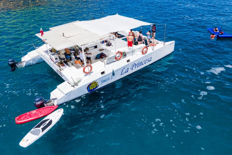52 foot luxury power catamaran cruising the coastline of Los Cabos