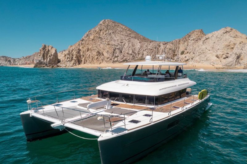 Luxury 630 Lagoon catamaran, a 63 foot premium vessel with dark hull in Cabo